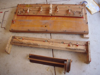 Photo of the the sound board with some of the swells; The lowers keyboard with pitman rods; and the vox humana in the foreground.